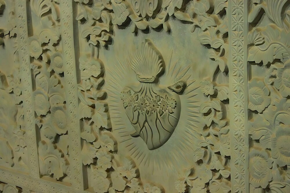 The heart pierced by a sword symbolizes Mary's sorrow, especially during the crucifixion of Jesus